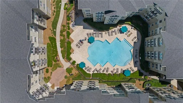 a room with furniture and pool table