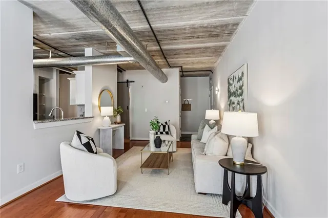 a living room with furniture and a table