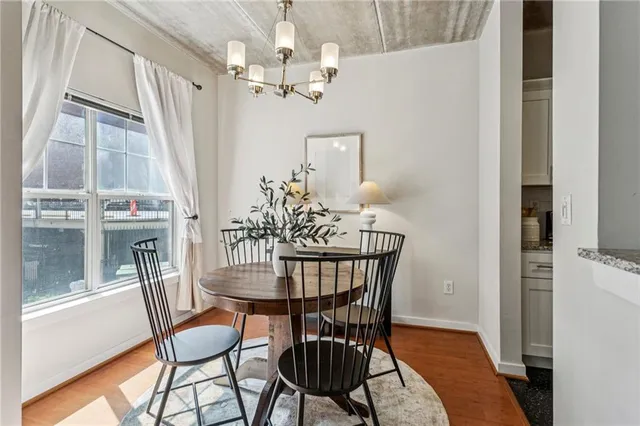 a view of a dining room with furniture window and wooden floor