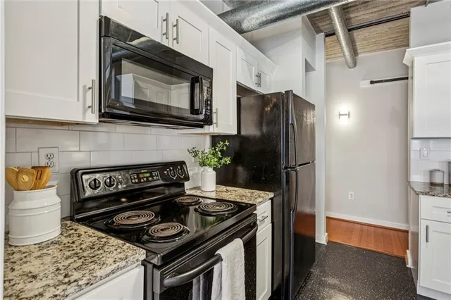 a kitchen with a stove and a microwave