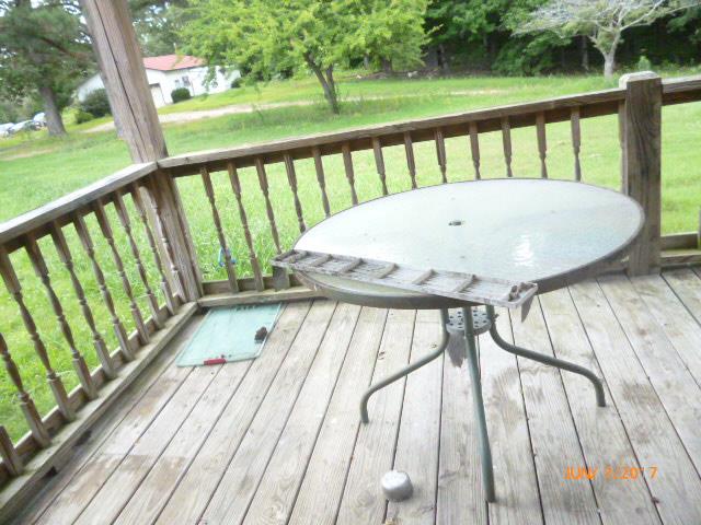 610 Beaverdam Road Camden, TN 38320 - Photo 4 of 15 a view of balcony with wooden floor and fence