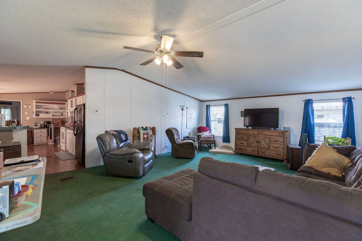 209 East Sheldon Avenue Thrall, TX 76578 - Photo 6 of 20 a living room with furniture and a flat screen tv