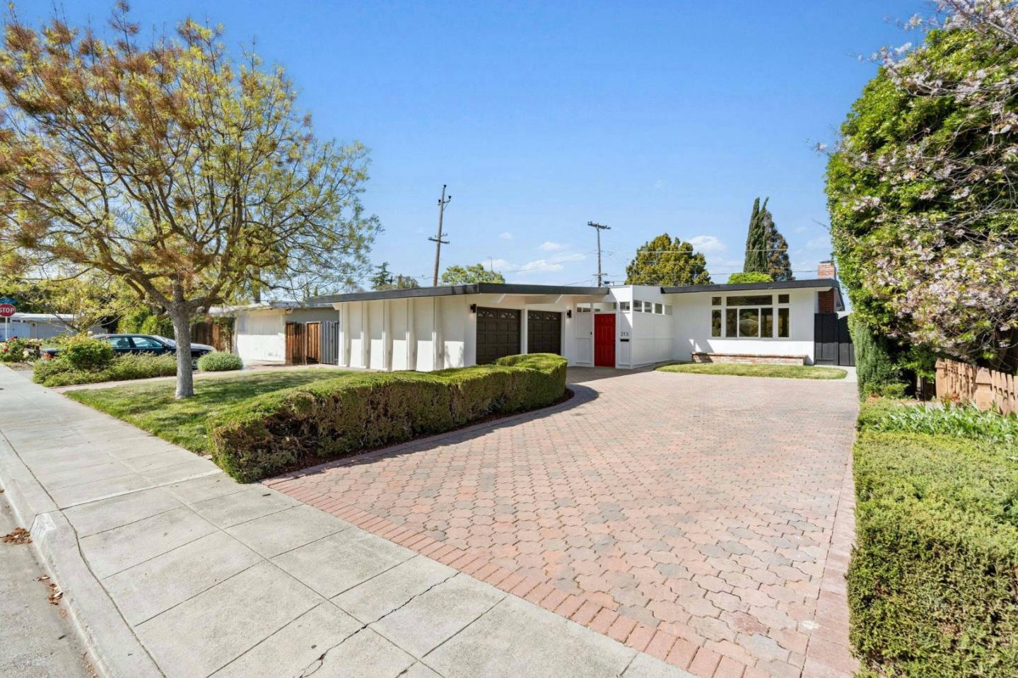 213 Thompson Square Mountain View, CA 94043 - Photo 1 of 37 a front view of a house with a garden