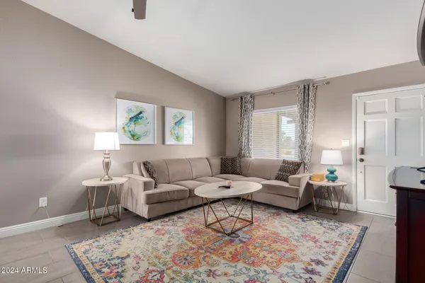 a living room with furniture and a rug