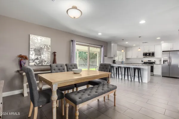a view of a dining room with furniture window and outside view