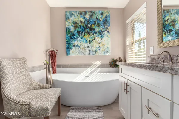 a bathroom with a bathtub and sink