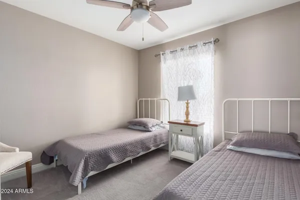 a bedroom with a bed and window