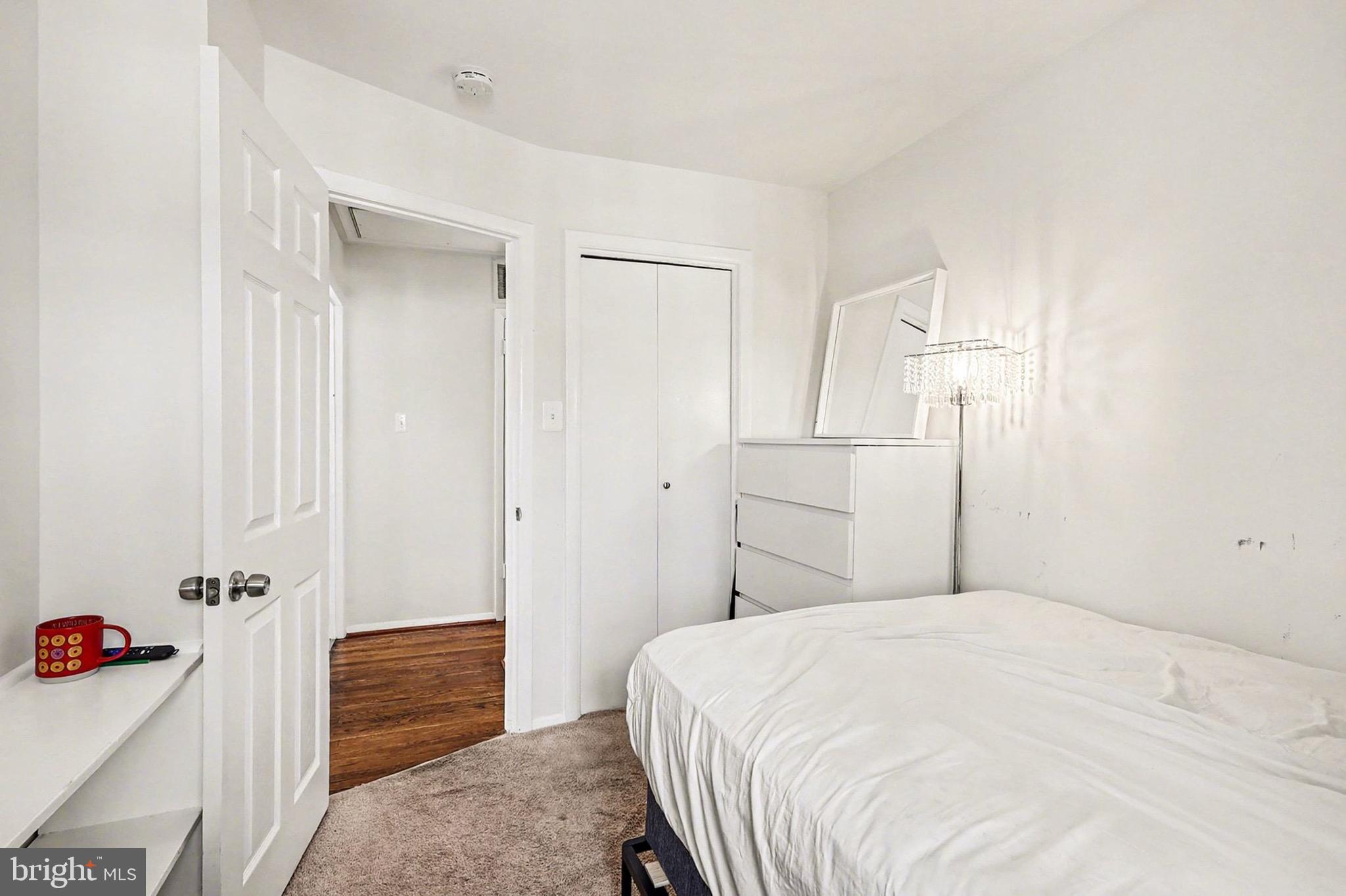 7112 Dalhouse Street Springfield, VA 22151 - Photo 12 of 25 a bedroom with a bed and a closet