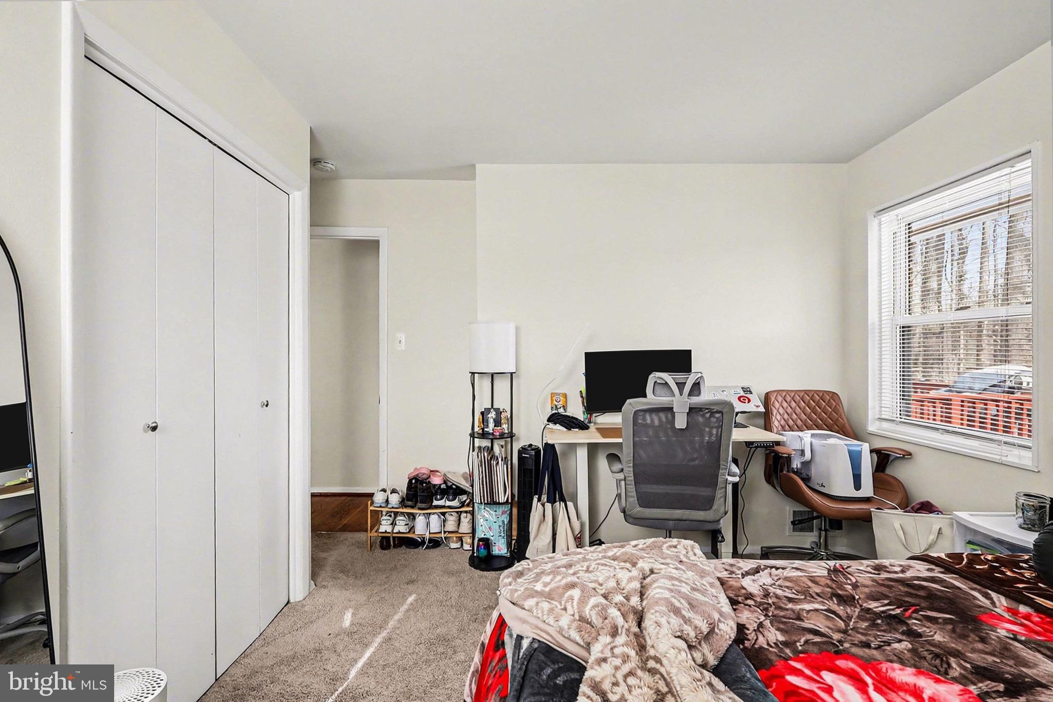 7112 Dalhouse Street Springfield, VA 22151 - Photo 15 of 25 a bedroom with bed and a window