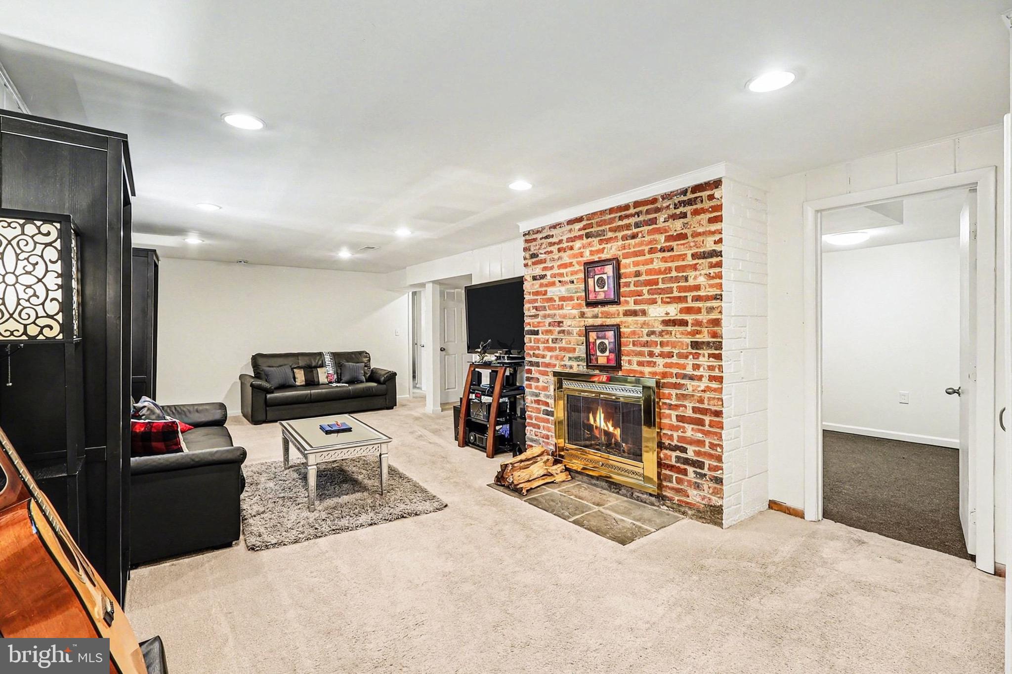 7112 Dalhouse Street Springfield, VA 22151 - Photo 16 of 25 a view of livingroom with furniture and flat screen tv