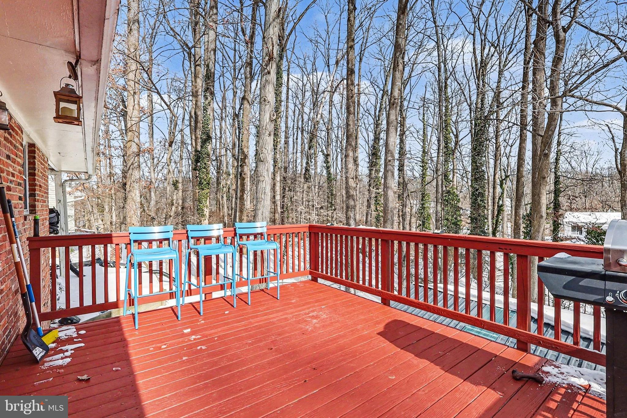 7112 Dalhouse Street Springfield, VA 22151 - Photo 7 of 25 a balcony with wooden floor and fence