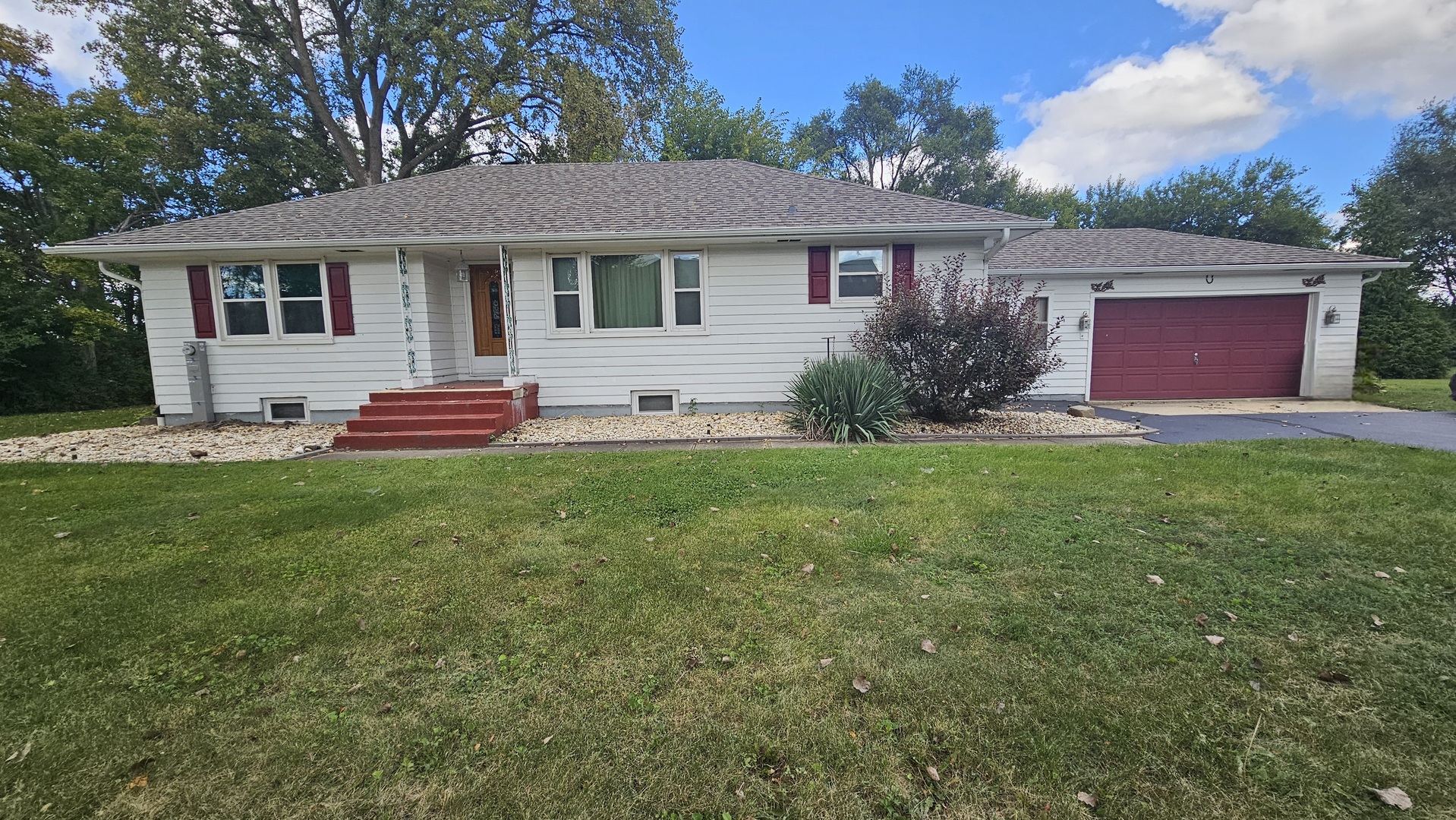 13658 East Flagg Road Rochelle, IL 61068 - Photo 1 of 65 a front view of house with yard and green space