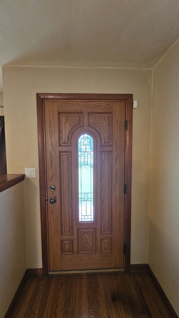 13658 East Flagg Road Rochelle, IL 61068 - Photo 11 of 65 an empty room with wooden floor and a window