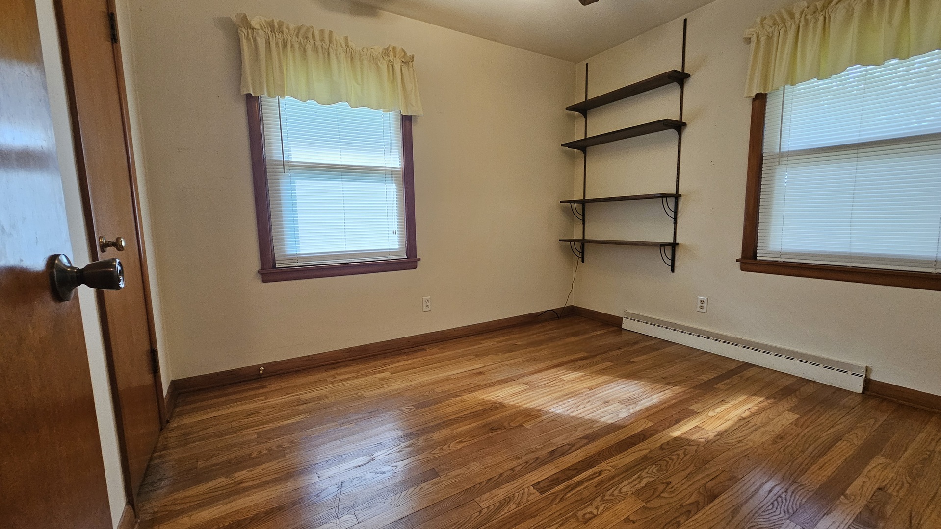 13658 East Flagg Road Rochelle, IL 61068 - Photo 26 of 65 a view of empty room with wooden floor and fan