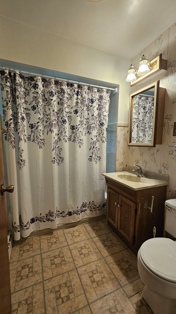 13658 East Flagg Road Rochelle, IL 61068 - Photo 27 of 65 a bathroom with a granite countertop sink toilet and shower