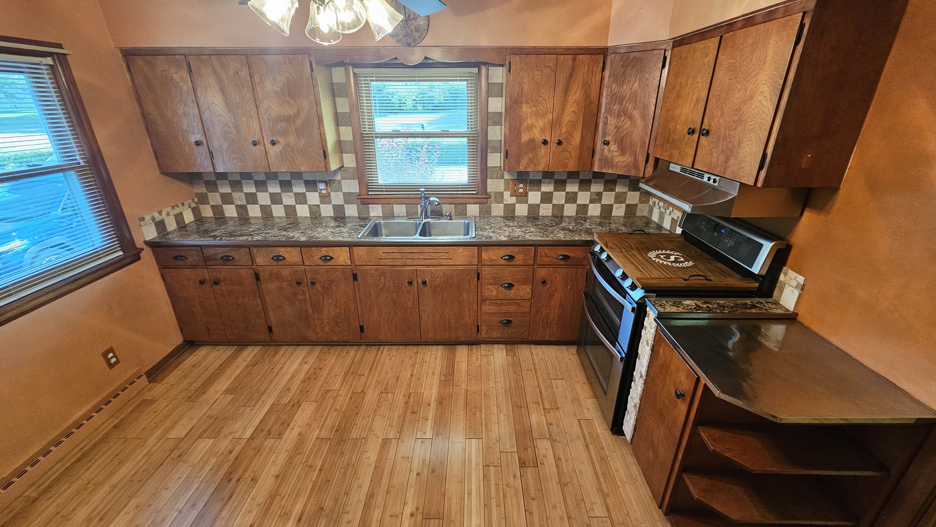 13658 East Flagg Road Rochelle, IL 61068 - Photo 28 of 65 a kitchen with wooden cabinets and a sink