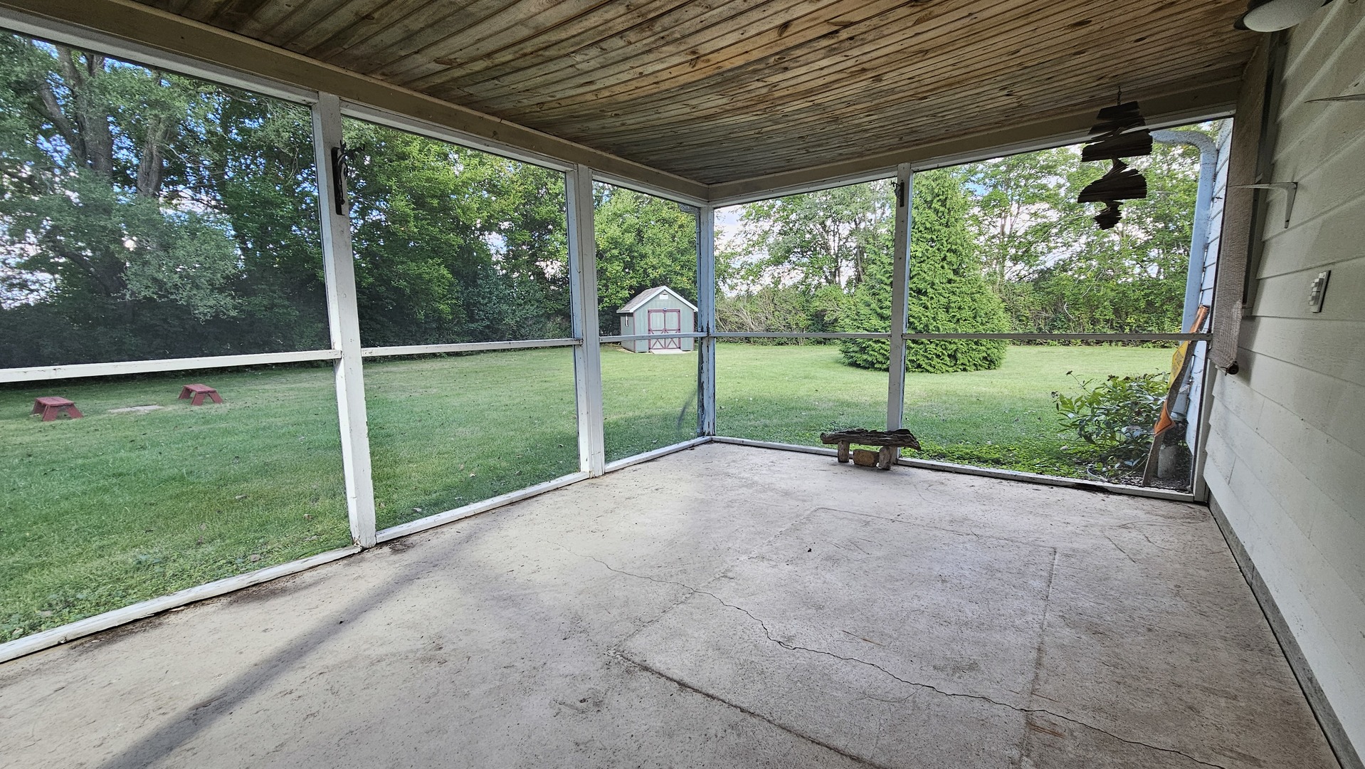 13658 East Flagg Road Rochelle, IL 61068 - Photo 57 of 65 a view of a yard with porch and wooden fence