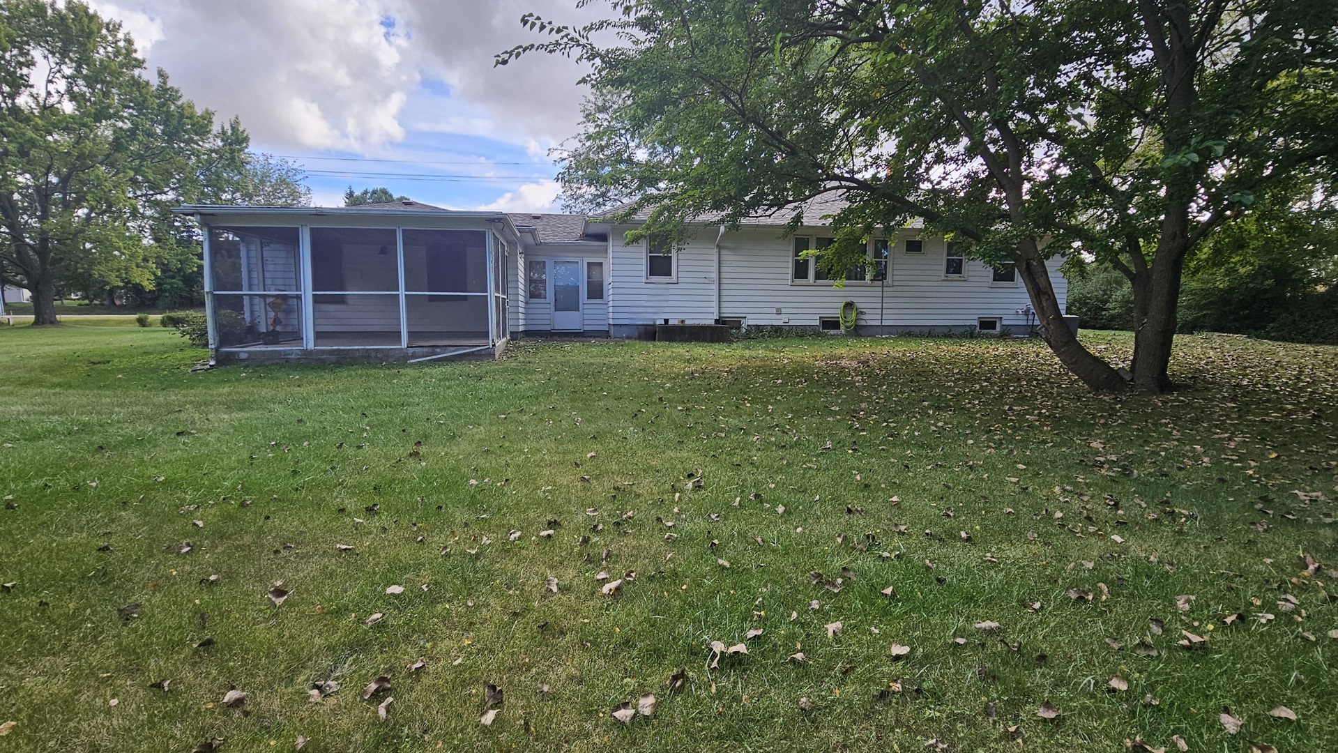 13658 East Flagg Road Rochelle, IL 61068 - Photo 65 of 65 a view of a backyard with potted plants and large trees