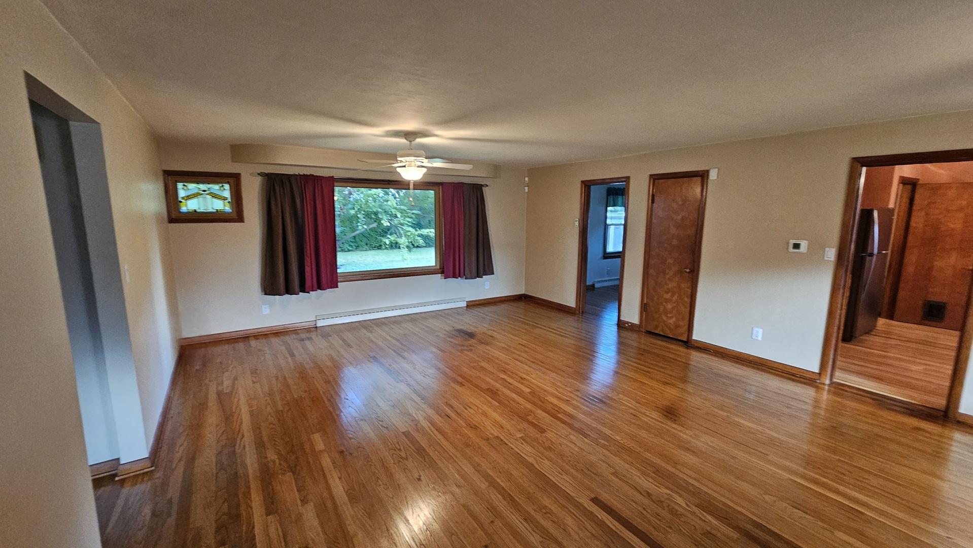 13658 East Flagg Road Rochelle, IL 61068 - Photo 10 of 65 wooden floor in an empty room with a window