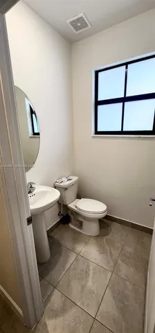 a stove top oven sitting inside of a kitchen