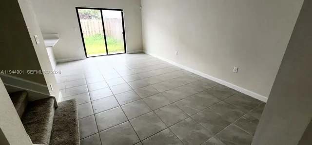 a kitchen with a sink a microwave a stove and refrigerator