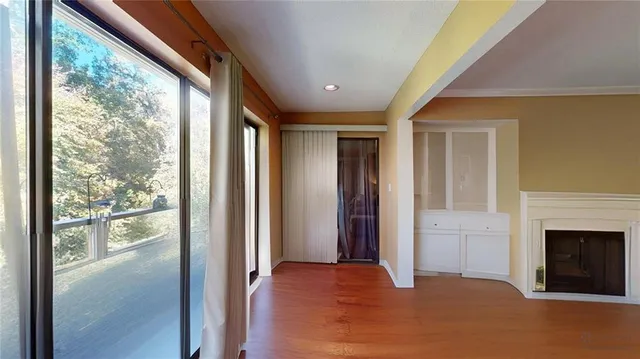 a backyard of a house with lots of green space and fountain