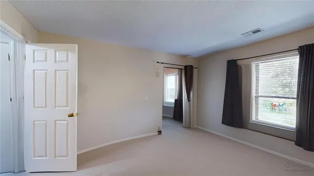 a bathroom with a sink toilet and mirror