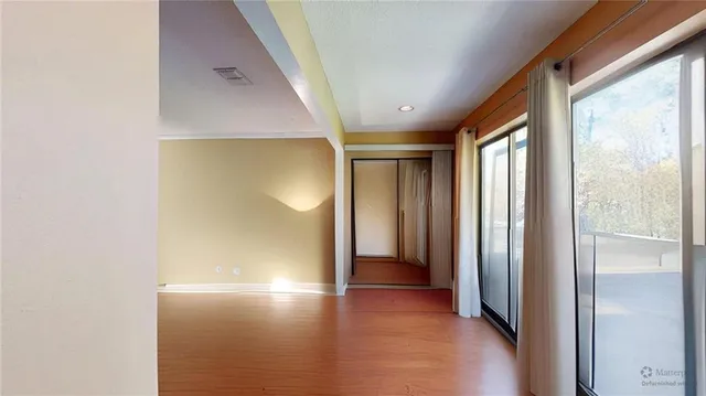 a spacious bathroom with a double vanity sink and a mirror