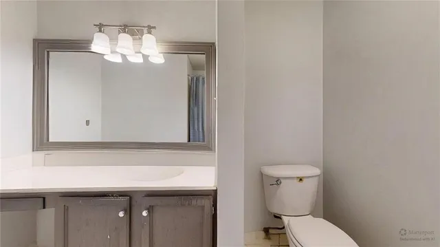 a bedroom with a bed and a dresser in it