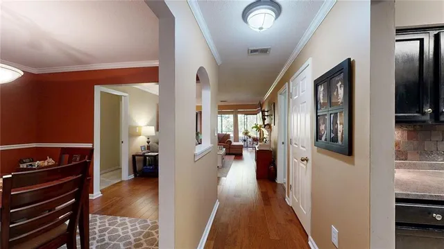 a kitchen with stainless steel appliances granite countertop a sink and a stove