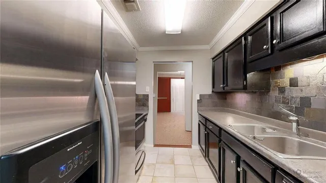 a view of a livingroom with wooden floor and a fireplace