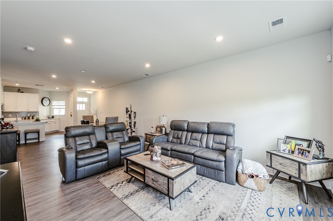 9073 Spring Green Loop Mechanicsville, VA 23116 - Photo 12 of 31 a living room with furniture and wooden floor