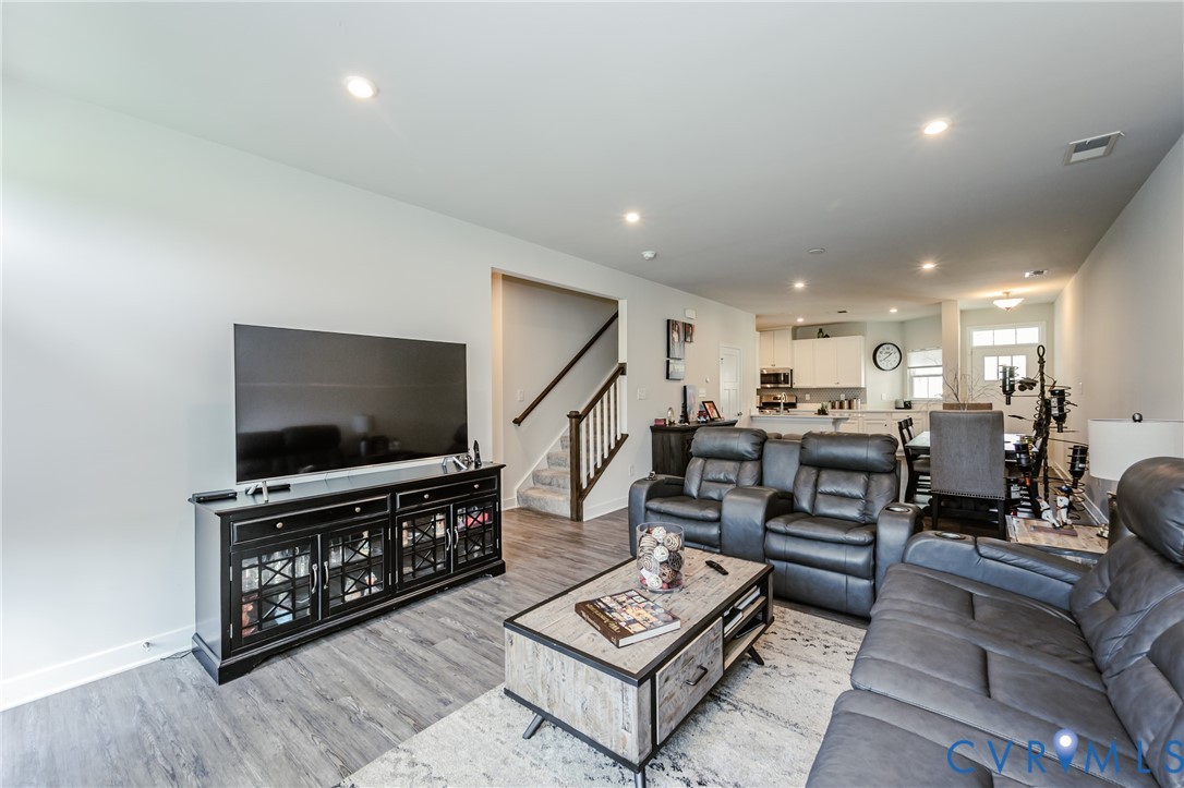 9073 Spring Green Loop Mechanicsville, VA 23116 - Photo 16 of 31 a living room with furniture and a flat screen tv