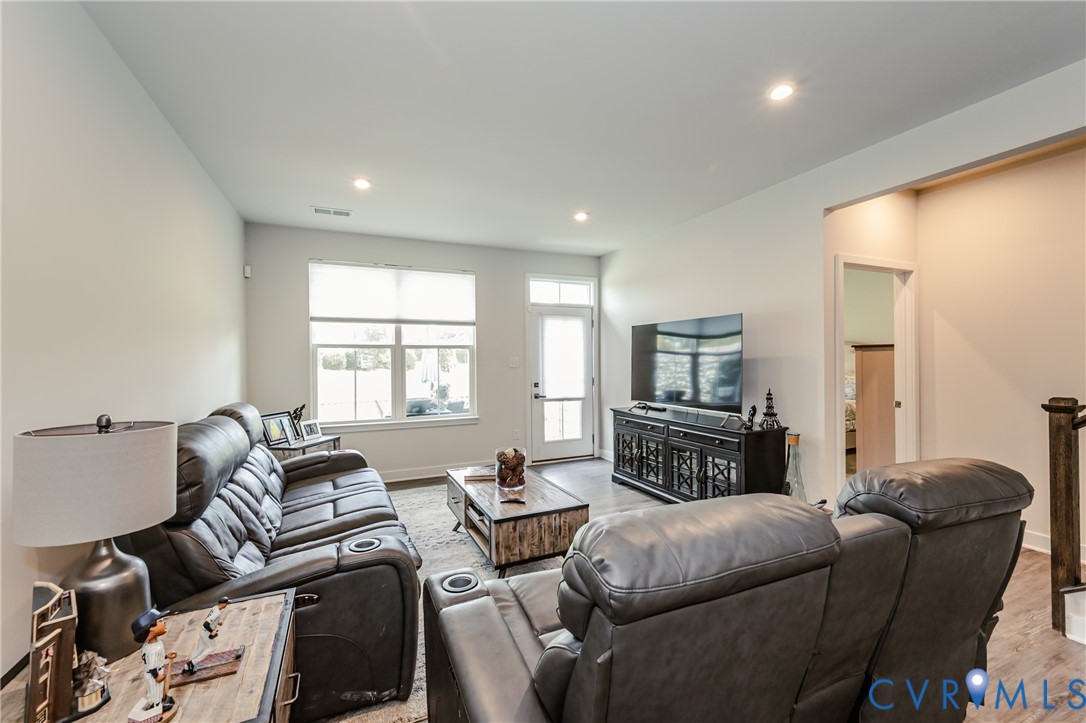 9073 Spring Green Loop Mechanicsville, VA 23116 - Photo 17 of 31 a living room with furniture window and a fireplace