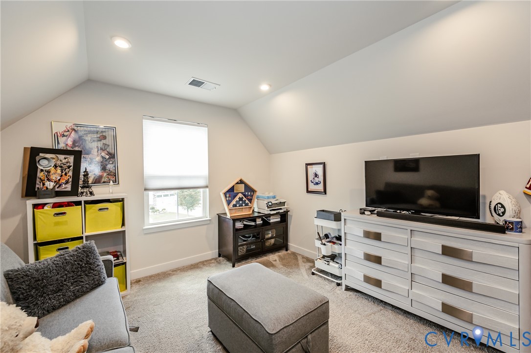 9073 Spring Green Loop Mechanicsville, VA 23116 - Photo 21 of 31 a living room with furniture and a flat screen tv