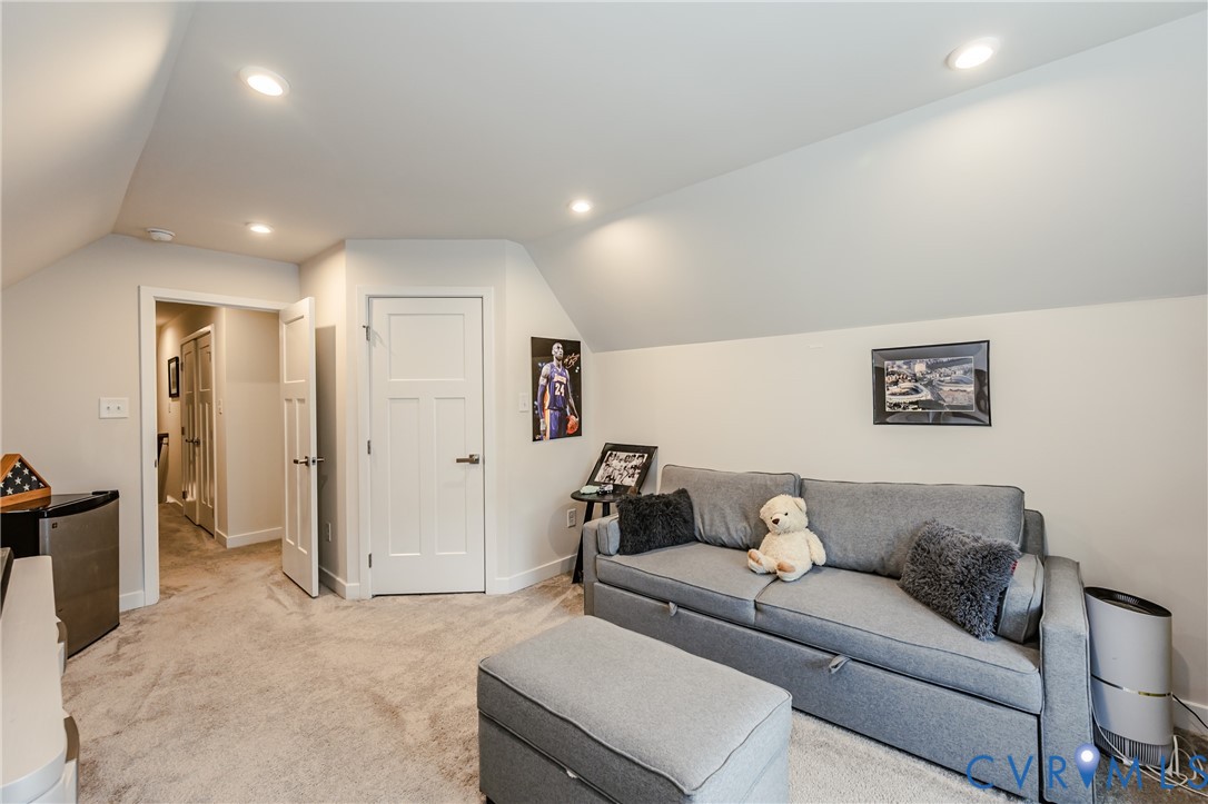 9073 Spring Green Loop Mechanicsville, VA 23116 - Photo 23 of 31 a living room with furniture and a walk in closet