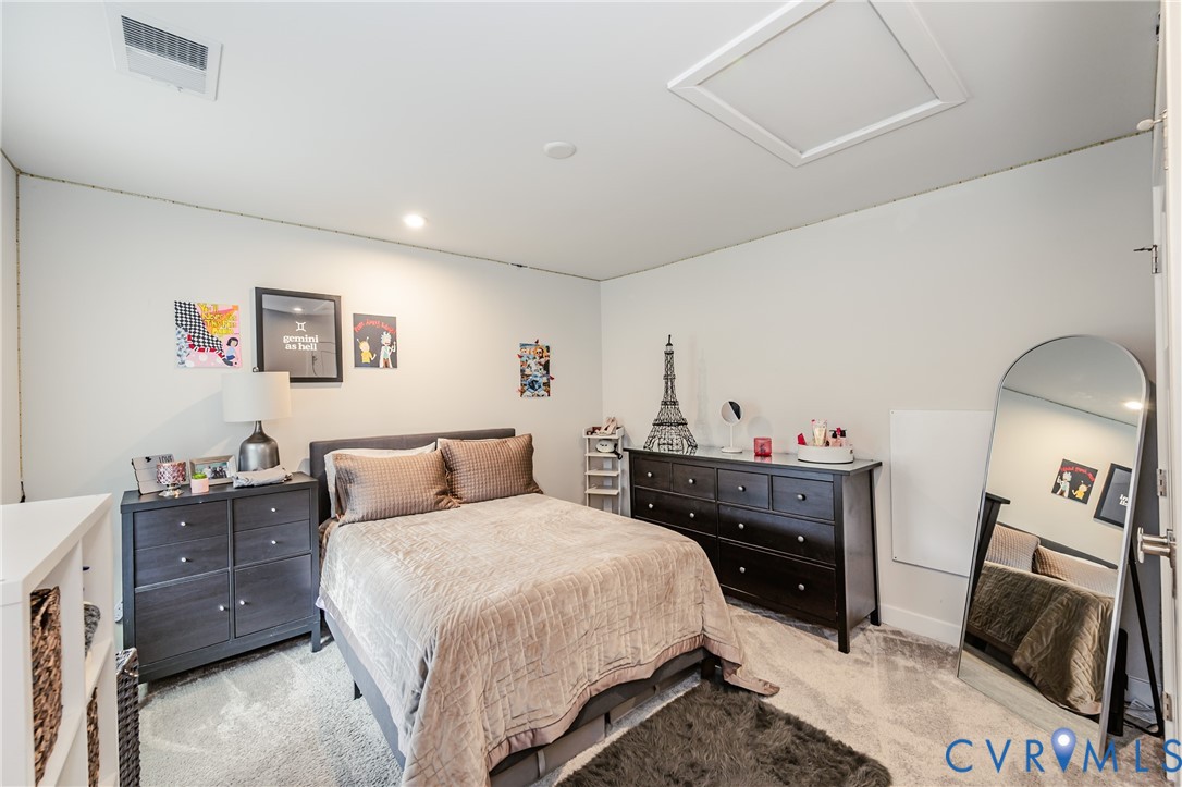 9073 Spring Green Loop Mechanicsville, VA 23116 - Photo 24 of 31 a bedroom with a bed and a television