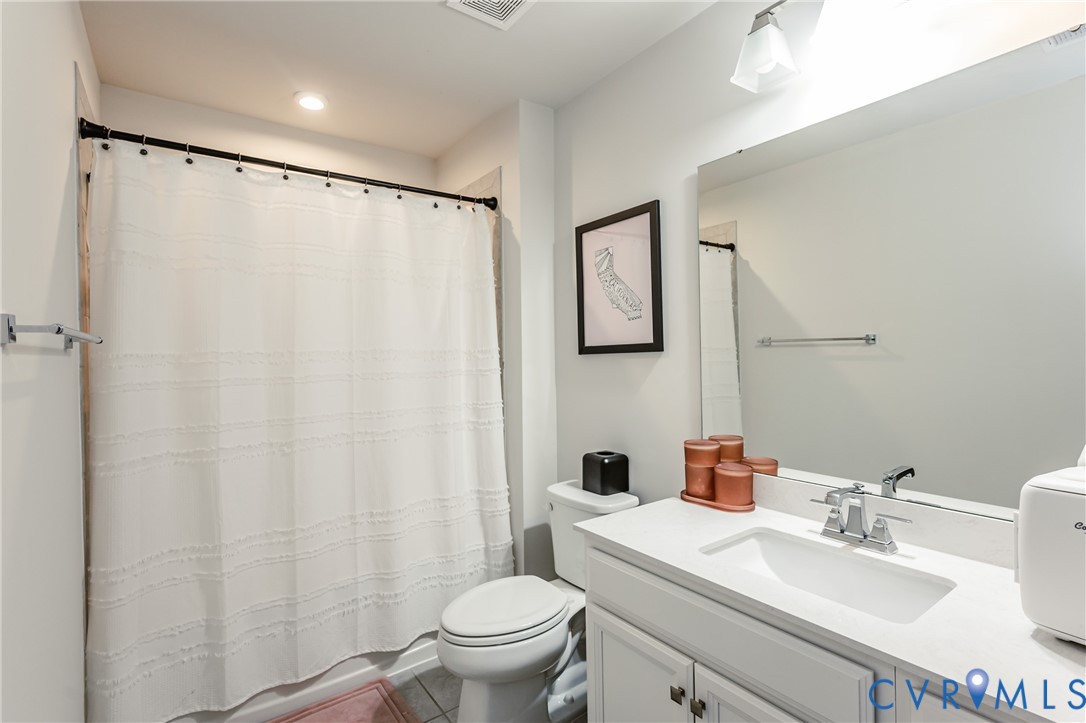 9073 Spring Green Loop Mechanicsville, VA 23116 - Photo 25 of 31 a bathroom with a sink toilet and shower