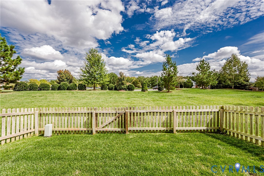 9073 Spring Green Loop Mechanicsville, VA 23116 - Photo 27 of 31 a view of a golf course with a garden