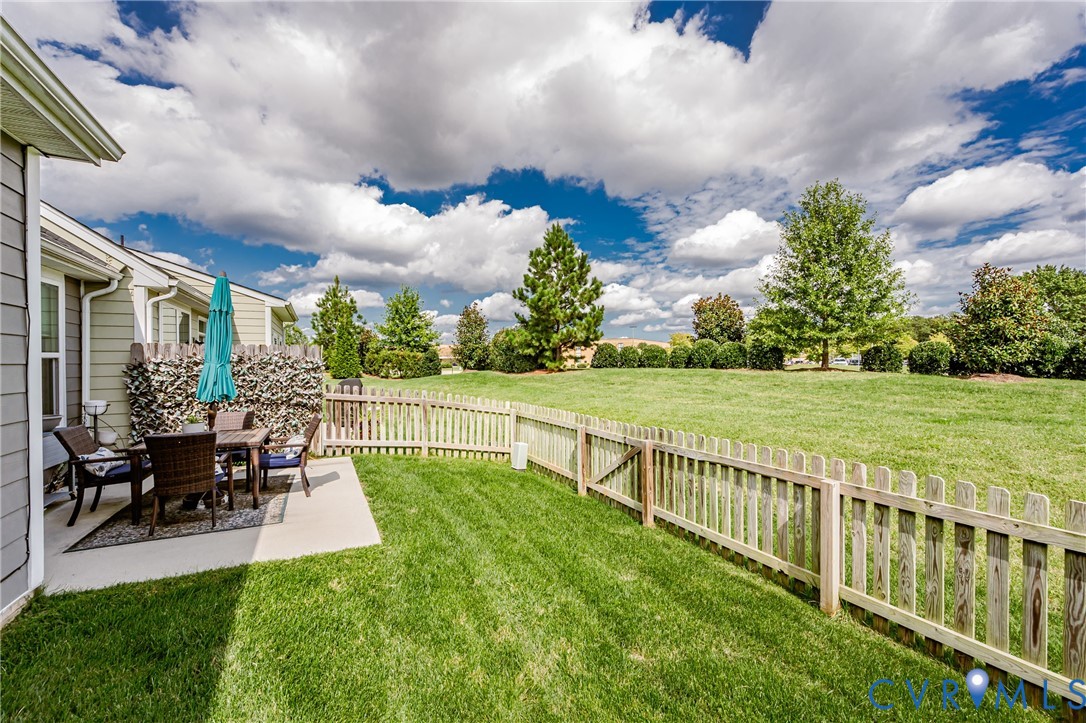 9073 Spring Green Loop Mechanicsville, VA 23116 - Photo 28 of 31 a view of a house with backyard and sitting area