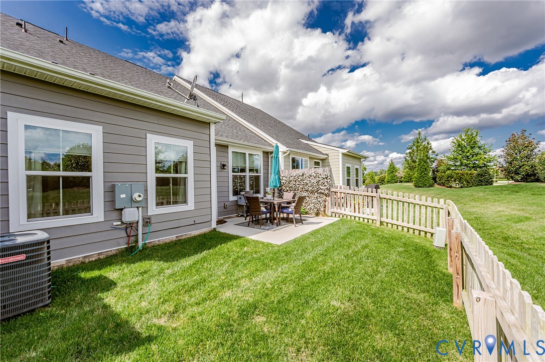 9073 Spring Green Loop Mechanicsville, VA 23116 - Photo 29 of 31 a view of house with backyard and porch