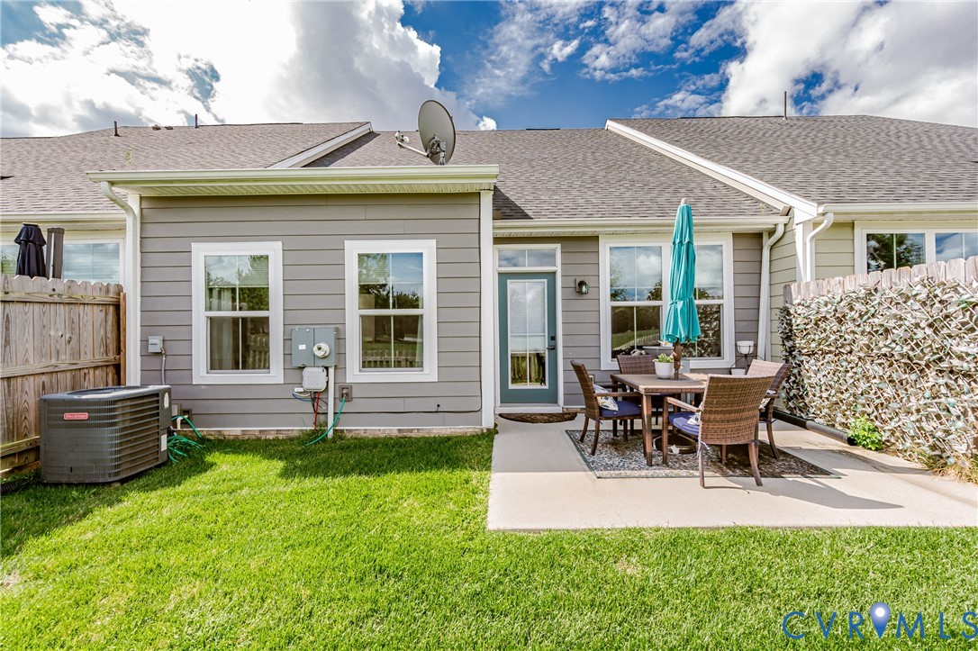 9073 Spring Green Loop Mechanicsville, VA 23116 - Photo 30 of 31 a view of a house with a backyard and chairs