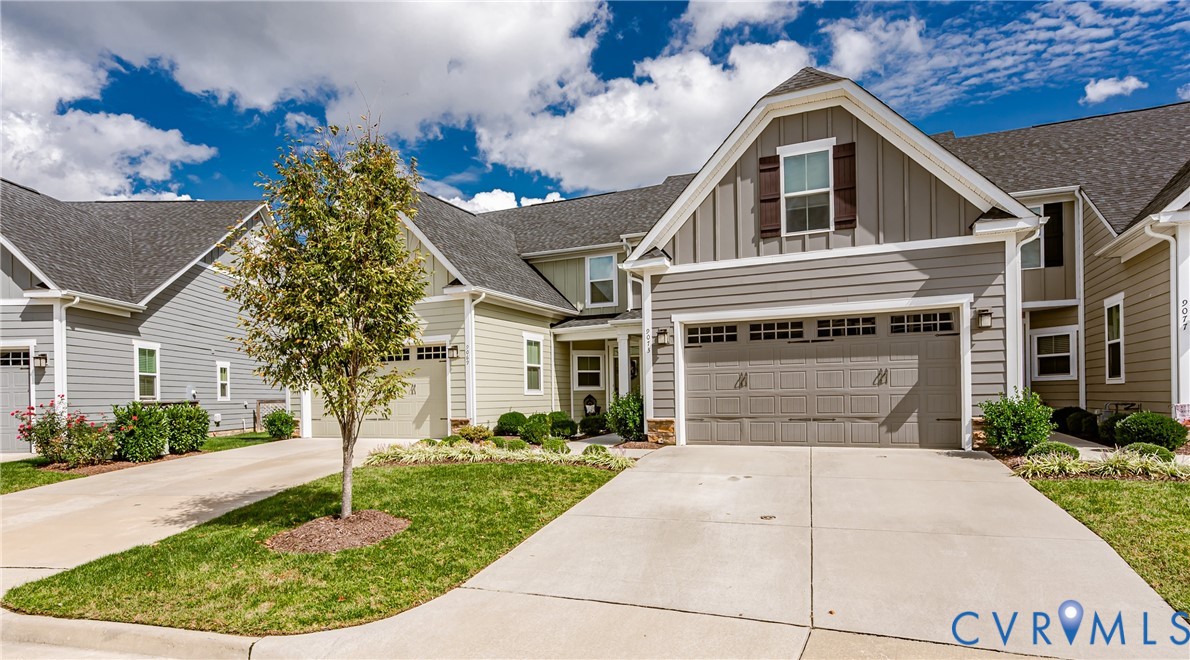 9073 Spring Green Loop Mechanicsville, VA 23116 - Photo 3 of 31 a front view of a house with a garden