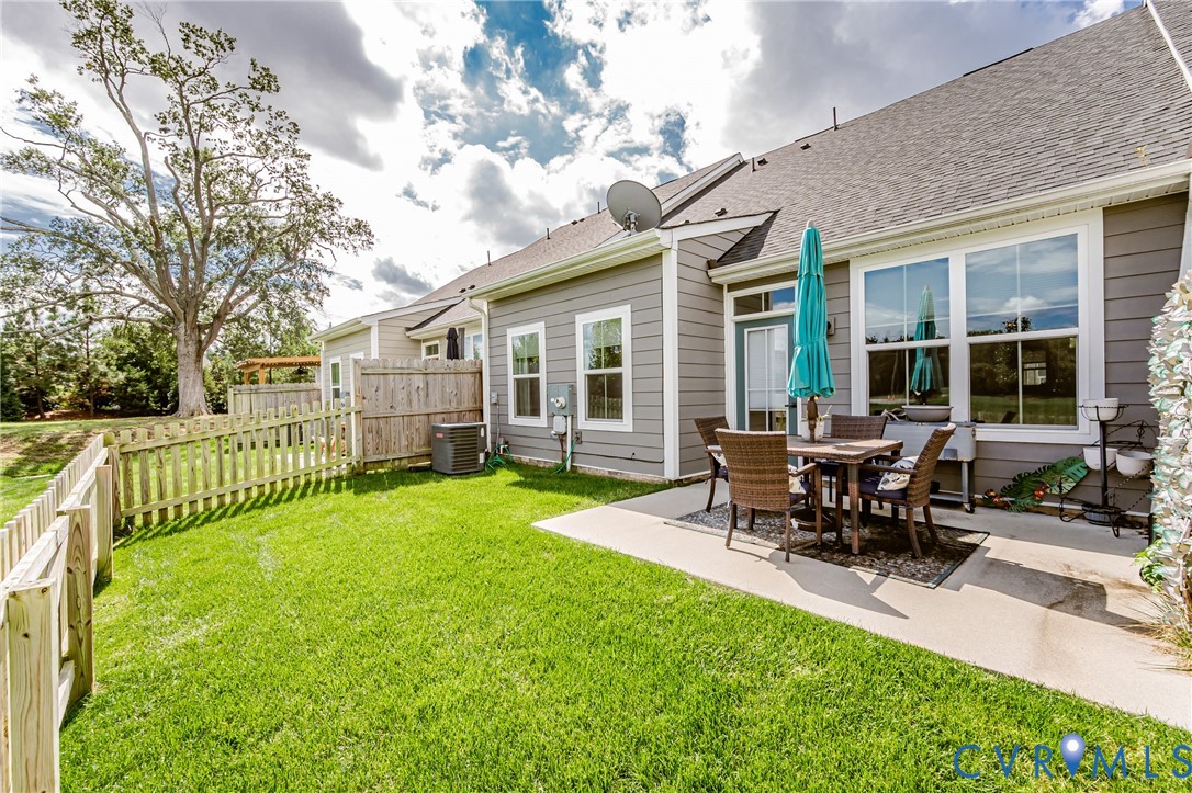 9073 Spring Green Loop Mechanicsville, VA 23116 - Photo 31 of 31 a view of a house with a backyard and sitting area