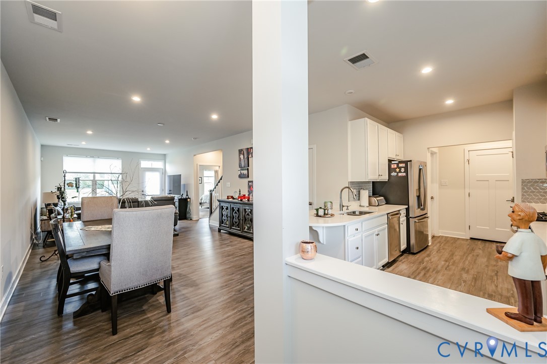9073 Spring Green Loop Mechanicsville, VA 23116 - Photo 6 of 31 a kitchen with refrigerator and cabinets
