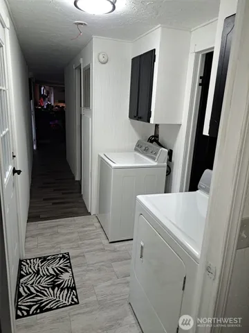 a view of storage and utility room with washer and dryer