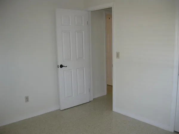 a view of hallway with closet