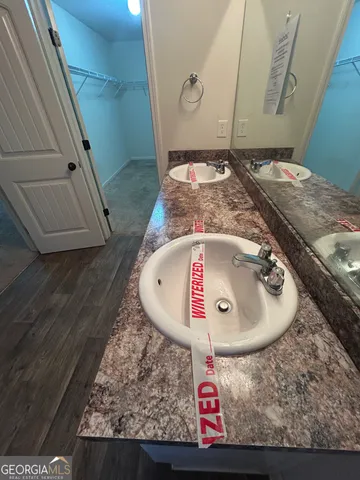 a bathroom with a glass shower door