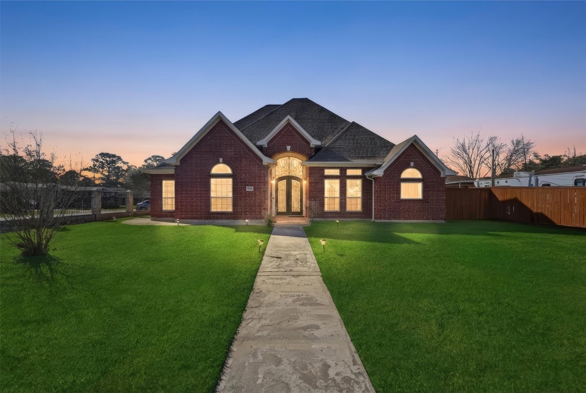 a front view of a house with a yard