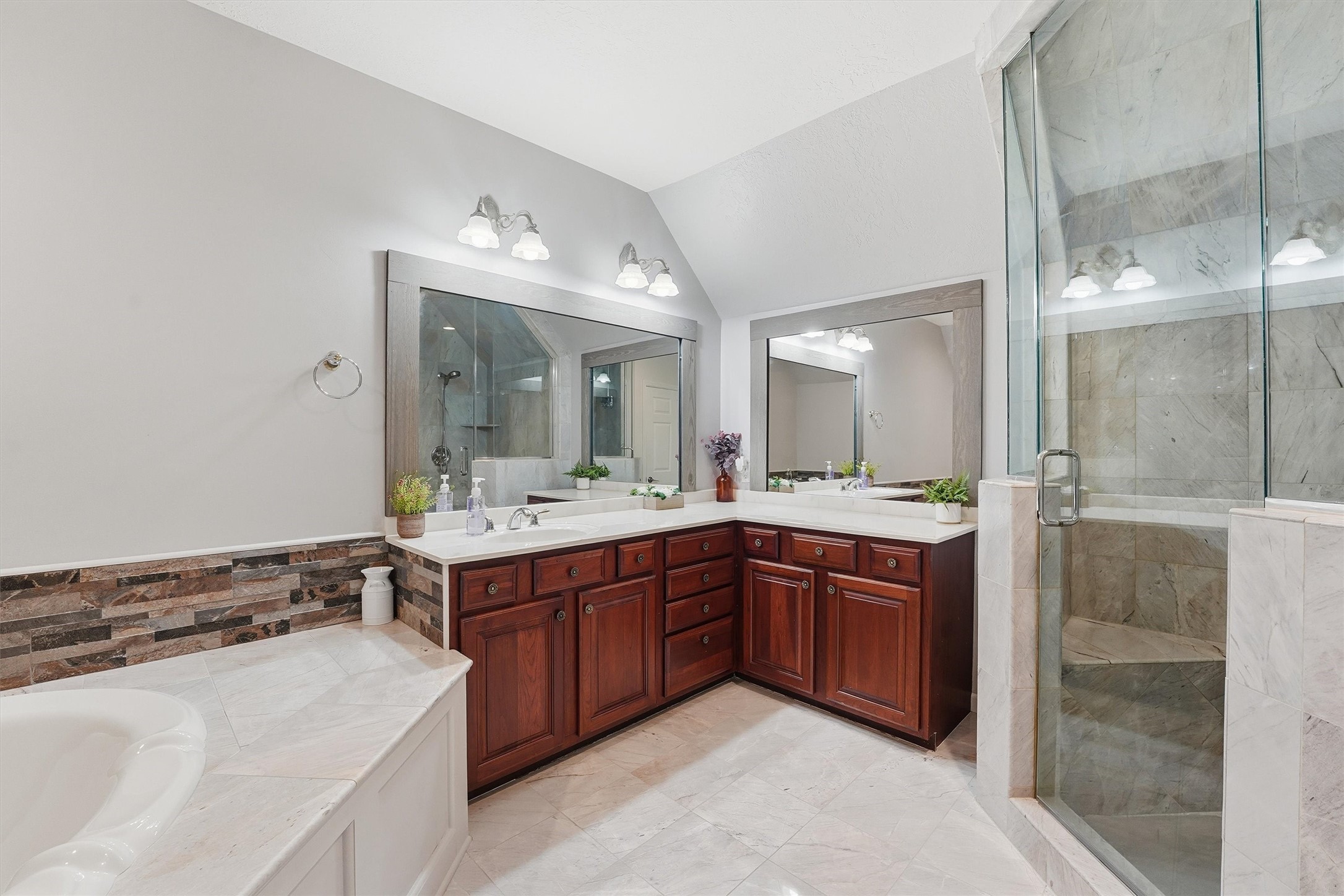 14103 Smith Road Humble, TX 77396 - Photo 12 of 39 a spacious bathroom with a tub sink shower and mirror